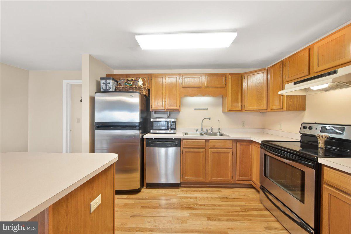 24524 Fullbrook Lane Dames Quarter, MD 21821 - Photo 15 of 45 a kitchen with stainless steel appliances granite countertop a sink stove and refrigerator
