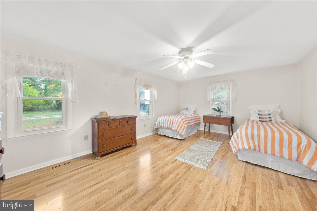 24524 Fullbrook Lane Dames Quarter, MD 21821 - Photo 18 of 45 a spacious bedroom with a bed and a window