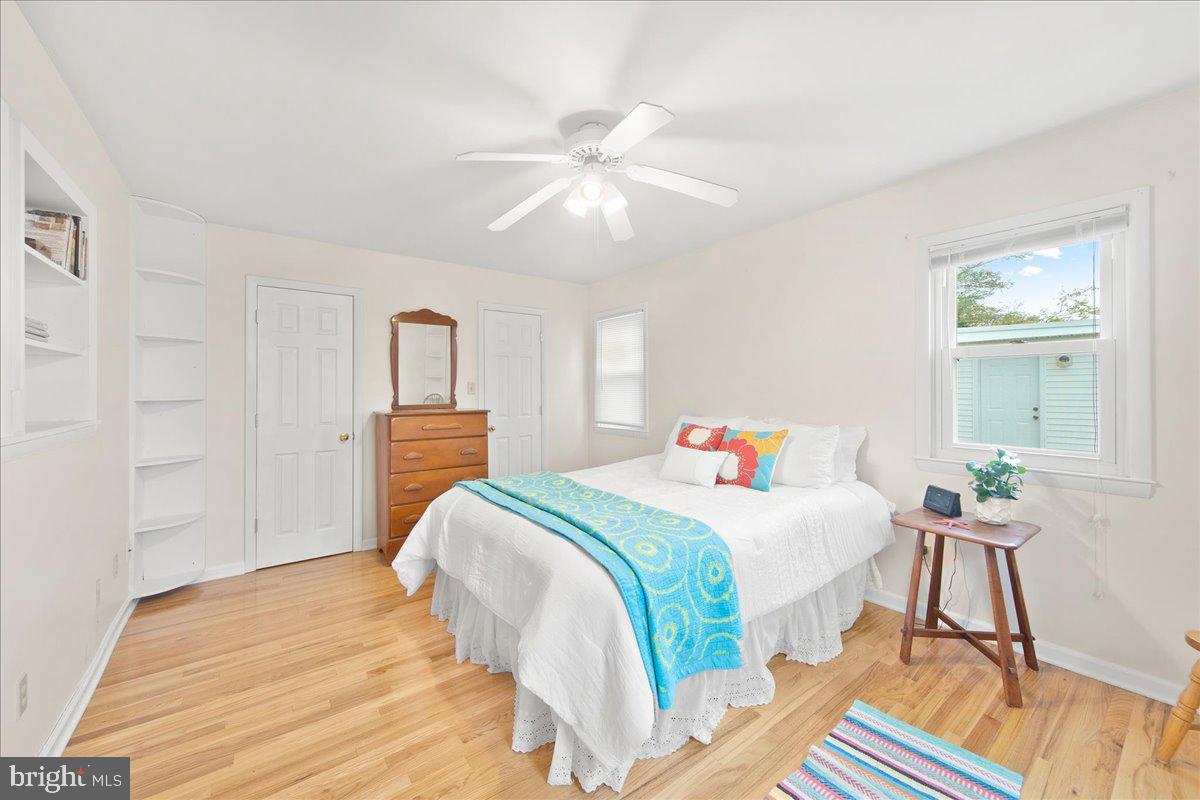 24524 Fullbrook Lane Dames Quarter, MD 21821 - Photo 22 of 45 a bedroom with a bed and a chandelier