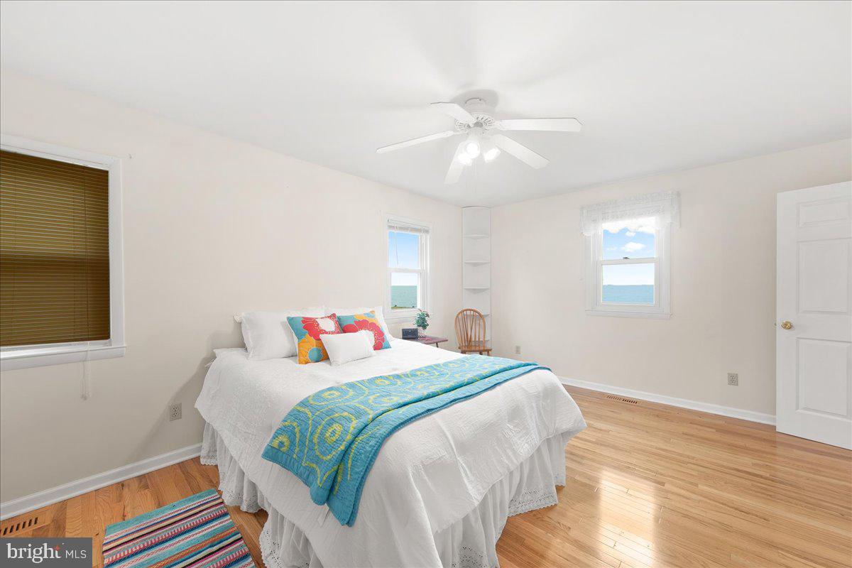 24524 Fullbrook Lane Dames Quarter, MD 21821 - Photo 23 of 45 a bedroom with a bed and a chandelier