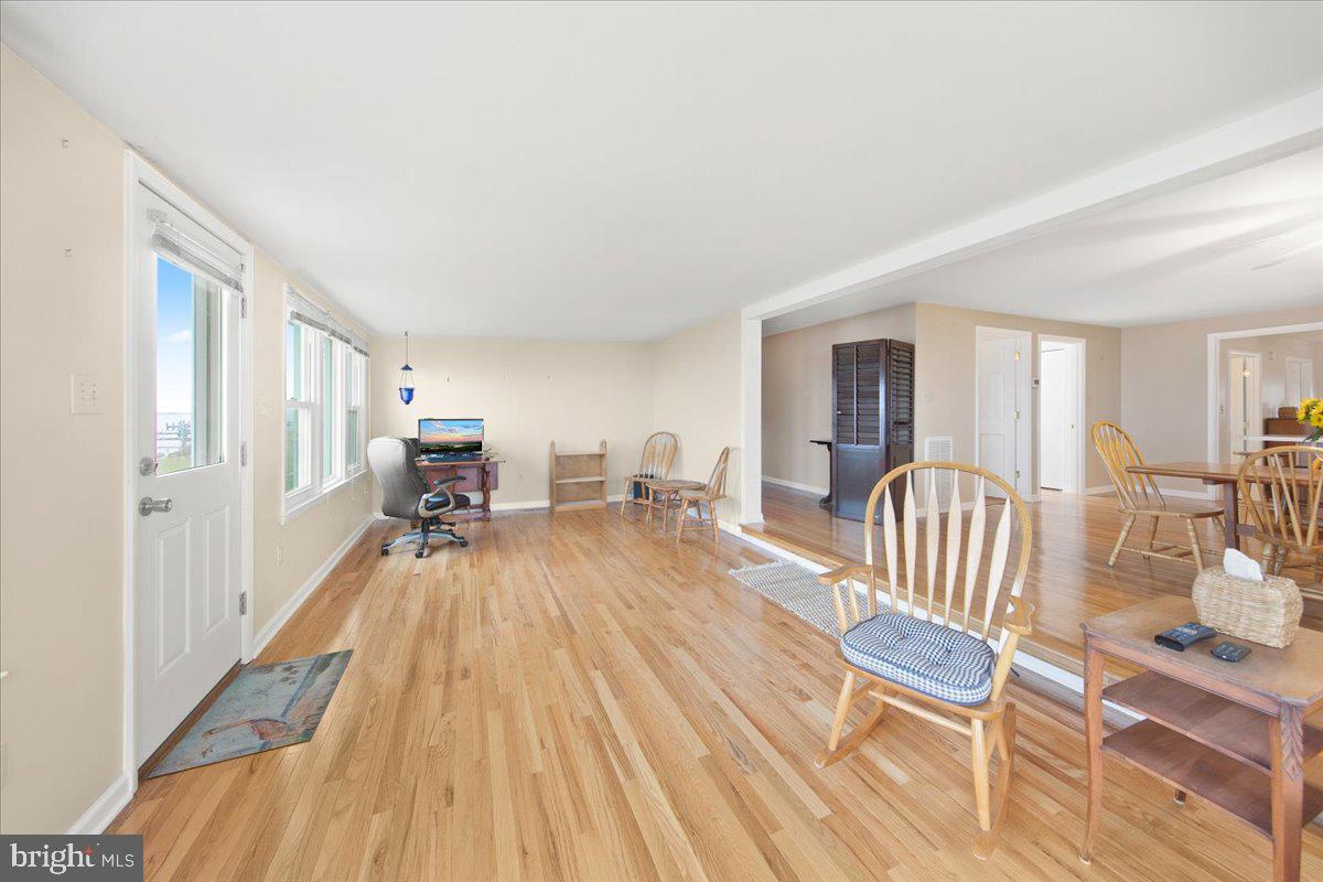 24524 Fullbrook Lane Dames Quarter, MD 21821 - Photo 8 of 45 a view of a livingroom with furniture hardwood floor and a view of bedroom