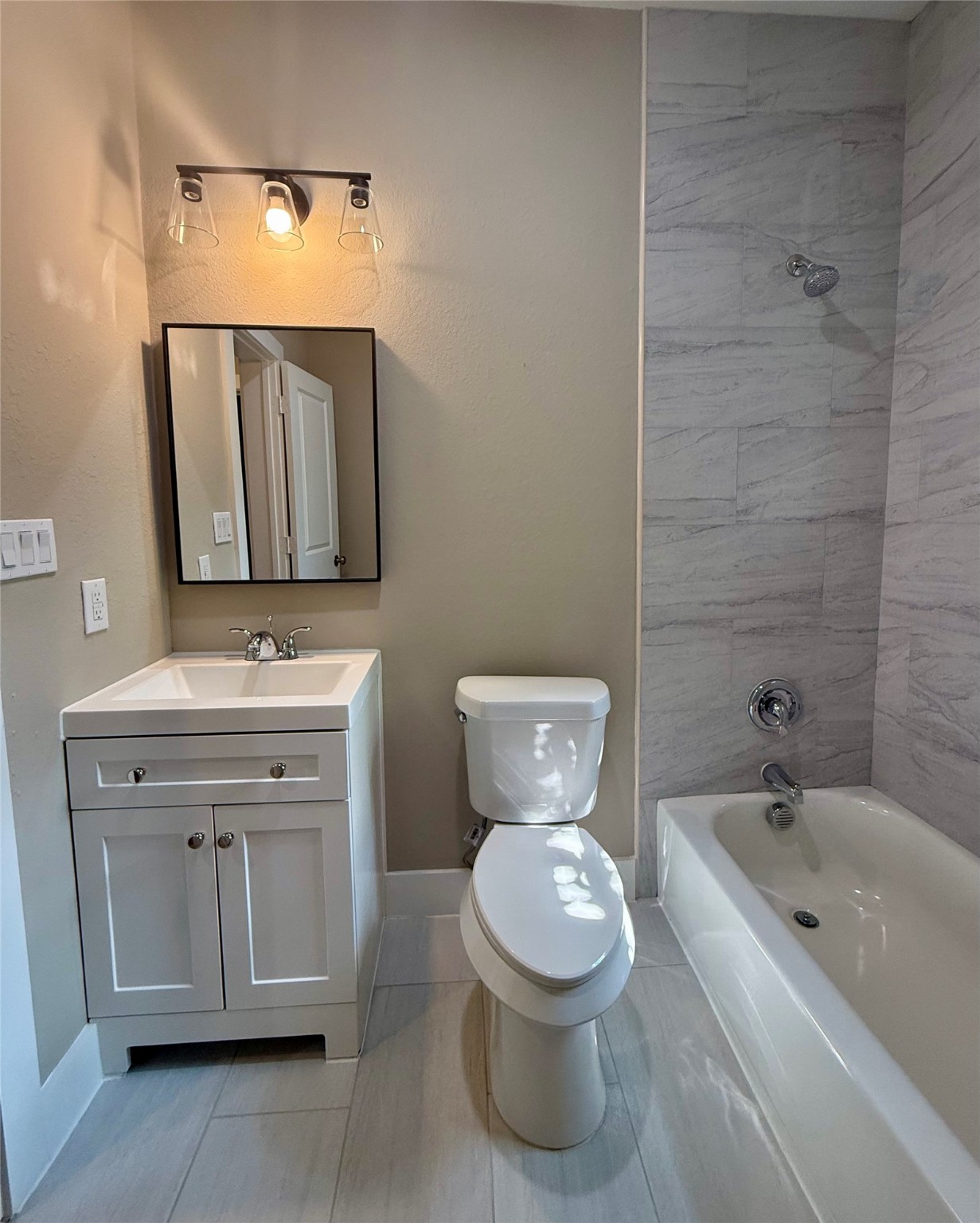 1816 Ryon Street Houston, TX 77009 - Photo 5 of 14 a bathroom with a toilet sink and mirror