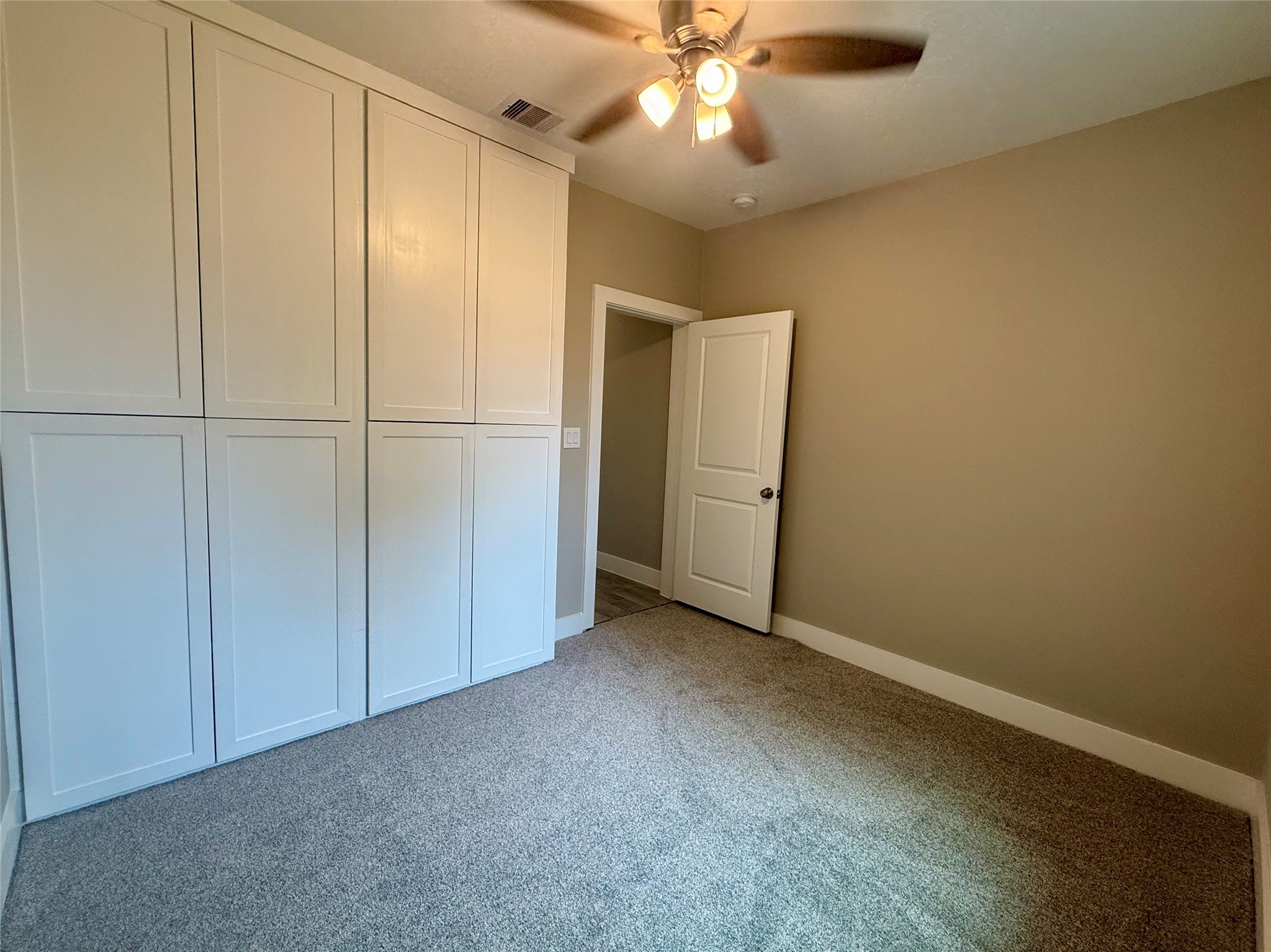 1816 Ryon Street Houston, TX 77009 - Photo 6 of 14 an empty room with closet area