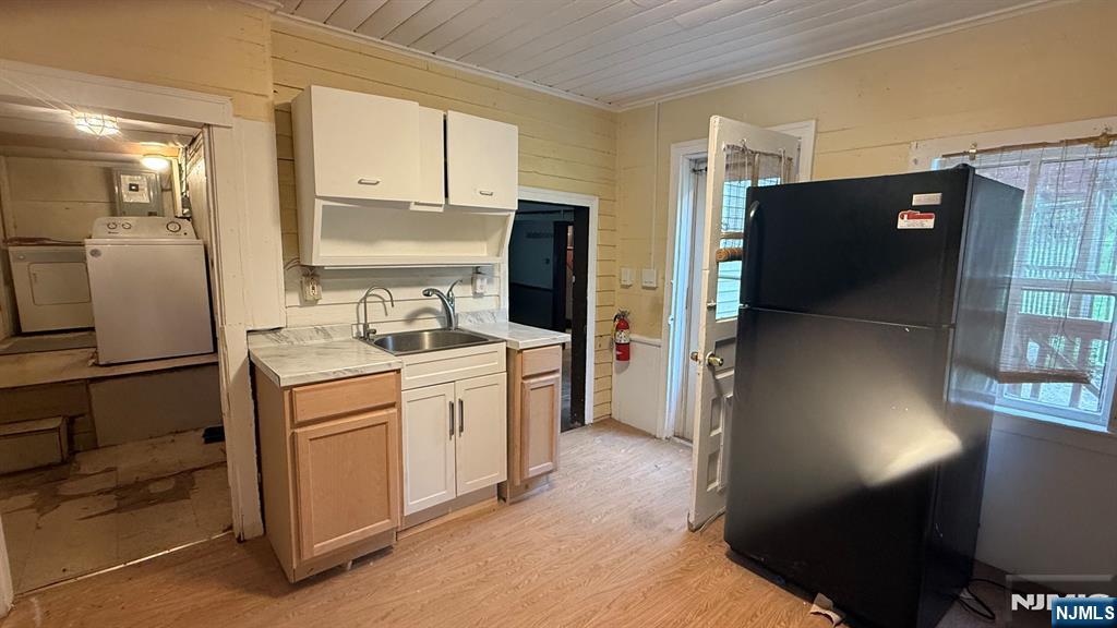 25 Coleman Hill Road Washington, NJ 07882 - Photo 11 of 18 a kitchen with a refrigerator sink and cabinets