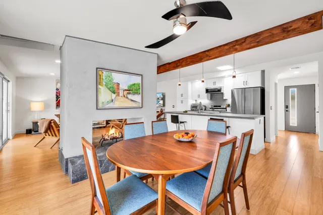 a dining room with furniture and wooden floor