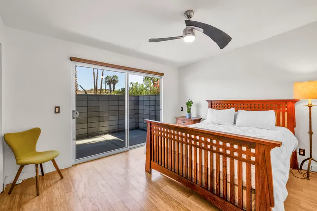 a bedroom with furniture and a window