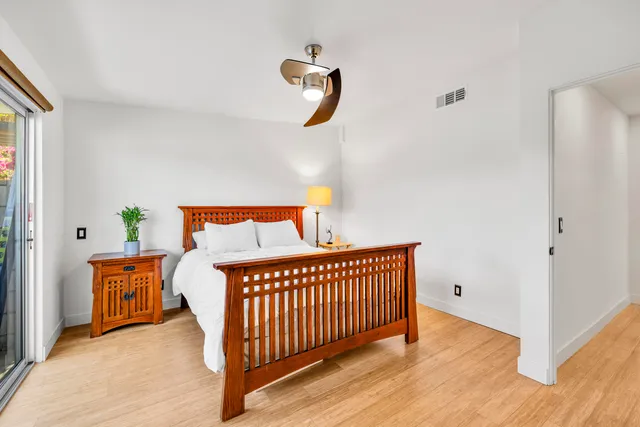 a bedroom with furniture and windows