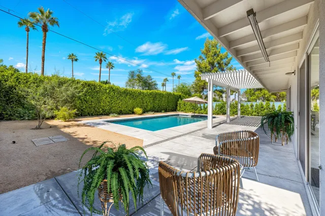 a view of swimming pool with a patio