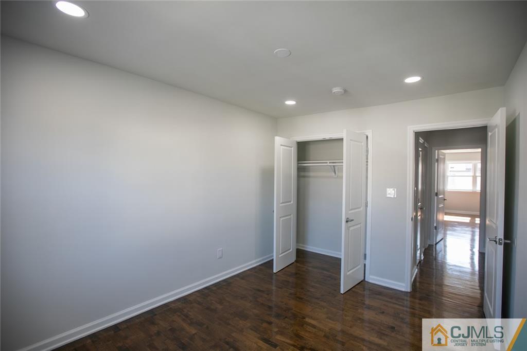 3405 Hana Road Edison, NJ 08817 - Photo 37 of 69 wooden floor in an empty room with a gallery