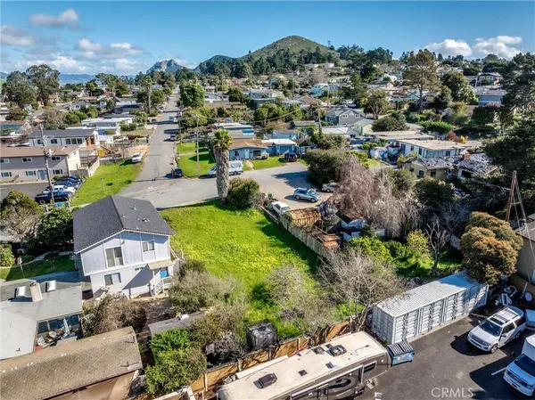 an aerial view of multiple houses with yard