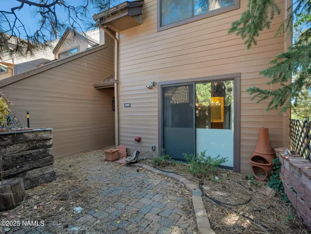 a view of a front door and a chair