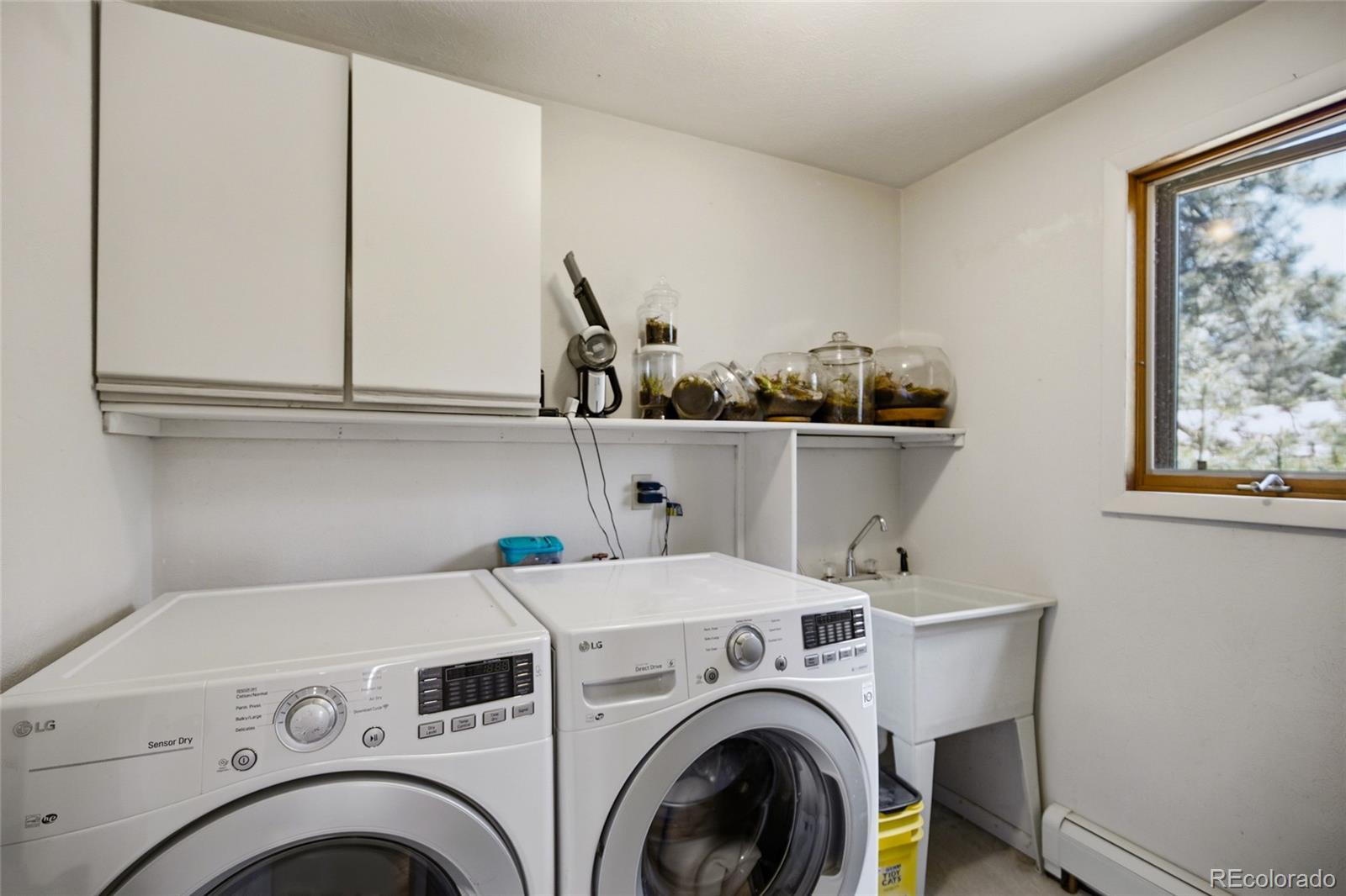 31280 Florence Road Conifer, CO 80433 - Photo 22 of 48 a utility room with dryer and washer