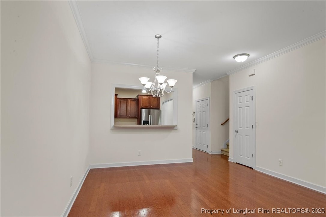 930 Westland Ridge Road Fayetteville, NC 28311 - Photo 21 of 50 a view of a room with chandelier and a chandelier
