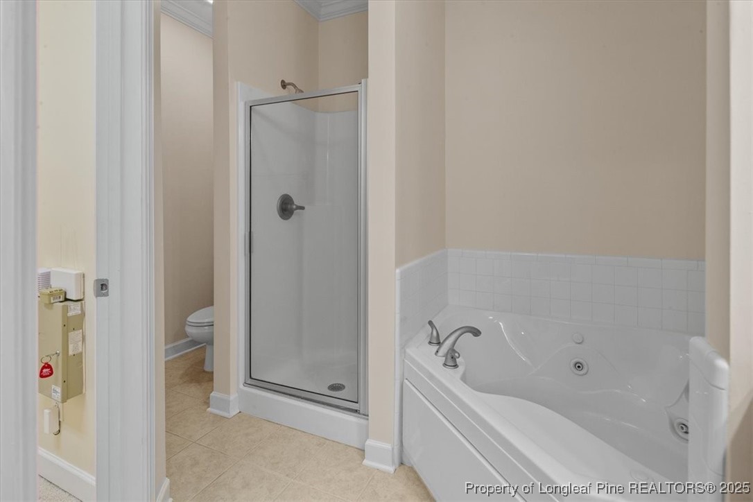 930 Westland Ridge Road Fayetteville, NC 28311 - Photo 26 of 50 a bathroom with a tub and a shower