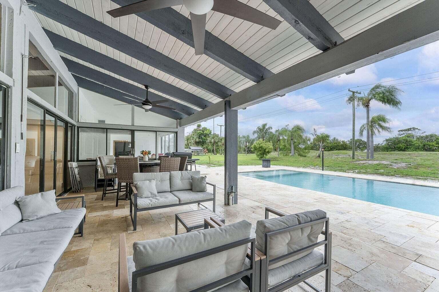 6031 Northwest 4th Avenue Boca Raton, FL 33487 - Photo 27 of 36 a outdoor space with patio the couches and pool