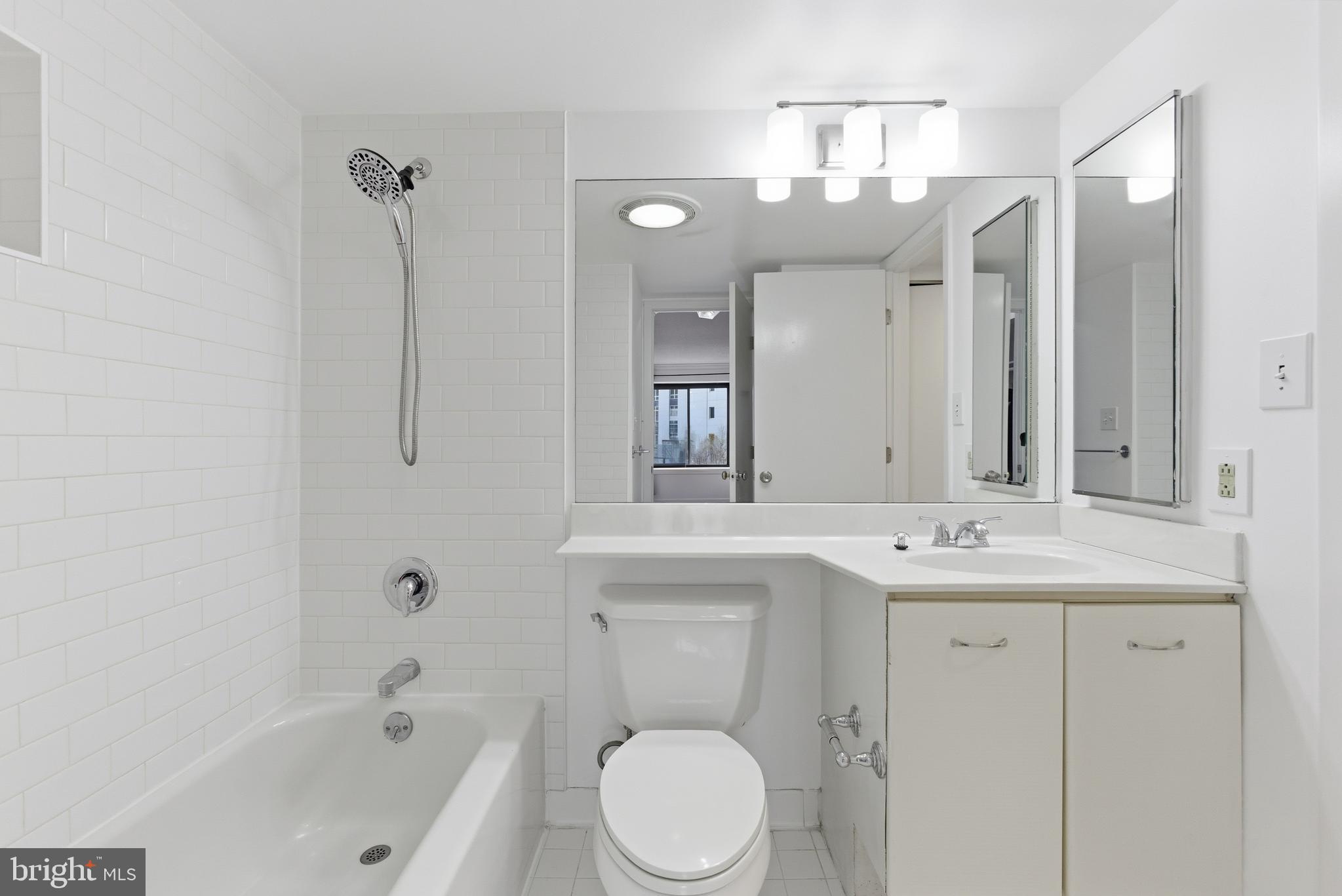 2111 Wisconsin Avenue Northwest, Unit 514 Washington, DC 20007 - Photo 12 of 17 a bathroom with a sink a toilet and shower