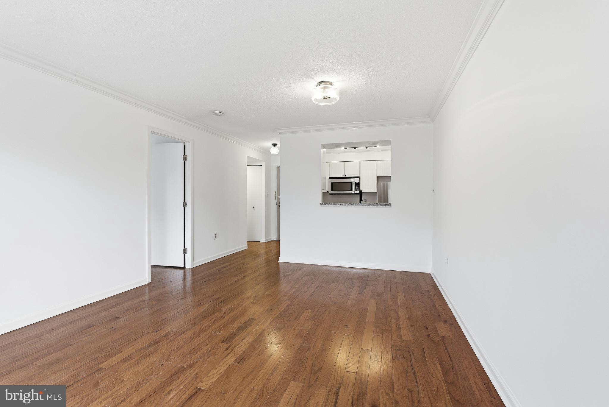 2111 Wisconsin Avenue Northwest, Unit 514 Washington, DC 20007 - Photo 5 of 17 a view of empty room with wooden floor