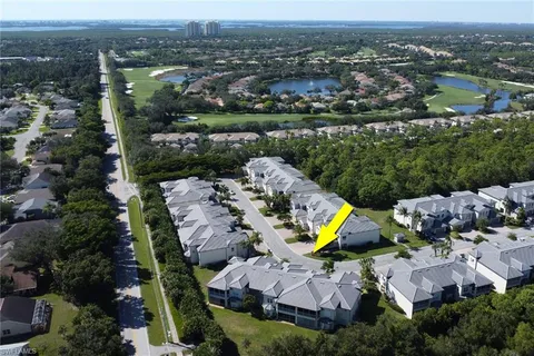an aerial view of a house with a swimming pool yard and outdoor seating