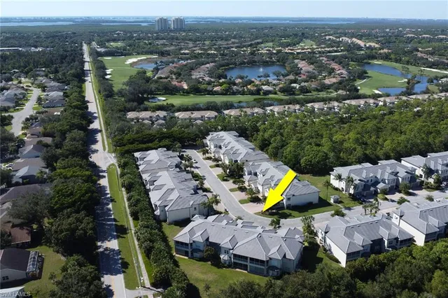 an aerial view of a house with a swimming pool yard and outdoor seating
