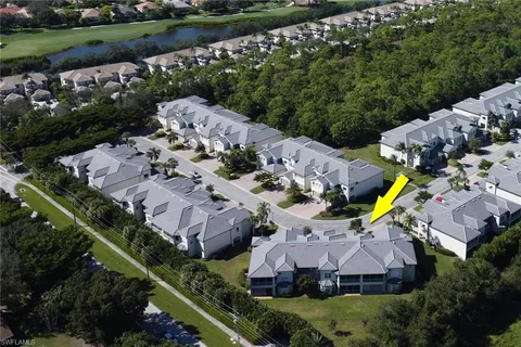 an aerial view of house with a garden and swimming pool