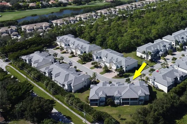 an aerial view of house with a garden and swimming pool