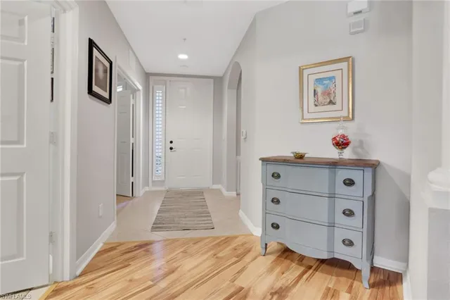 a view of a bedroom with baby bed and hallway