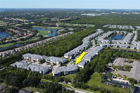 an aerial view of house with a swimming pool yard and outdoor seating