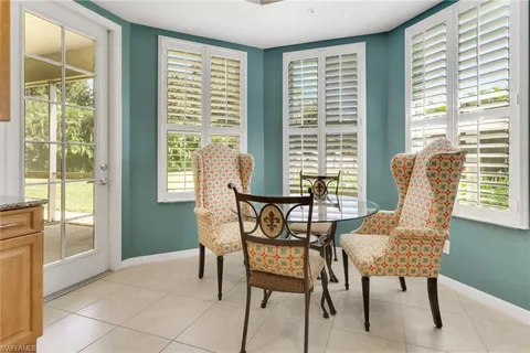 a view of a dining room with furniture and windows