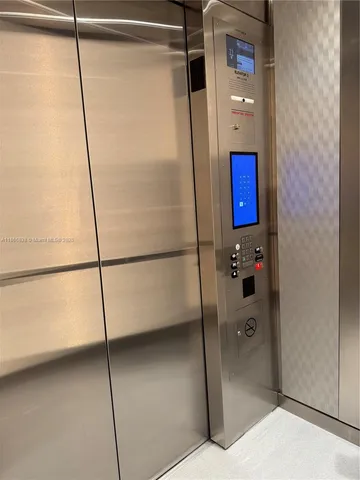a bathroom with a shower and a glass door