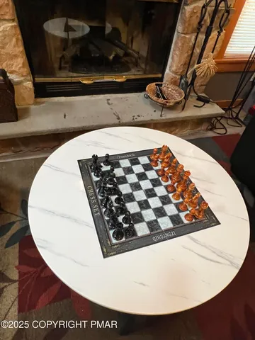 a room with a couch and a potted plant