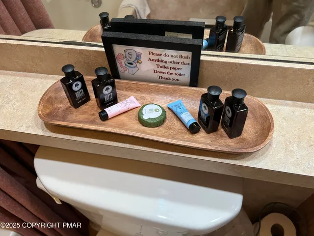 a bathroom with a sink a toilet and tub