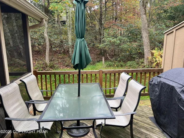a view of a dining room with furniture and window