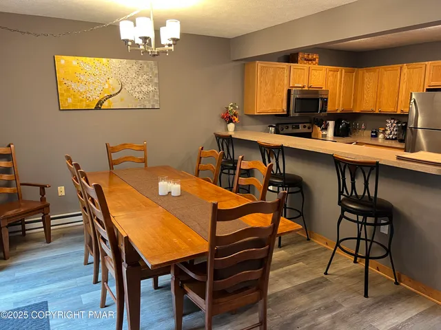 a table and chairs in a kitchen