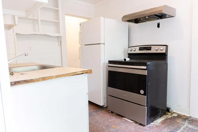 a kitchen with a stove and a microwave