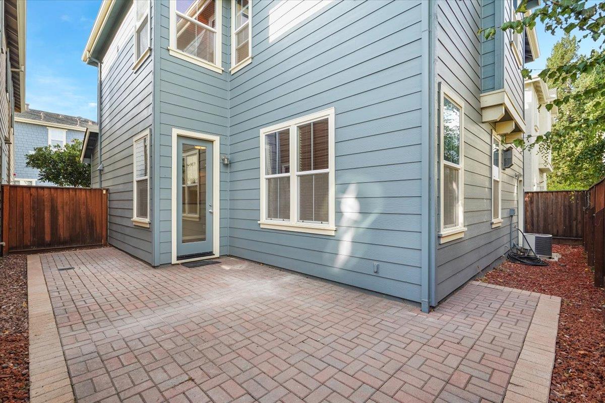 7835 Dickens Way Gilroy, CA 95020 - Photo 16 of 16 a view of a house with backyard and wooden fence