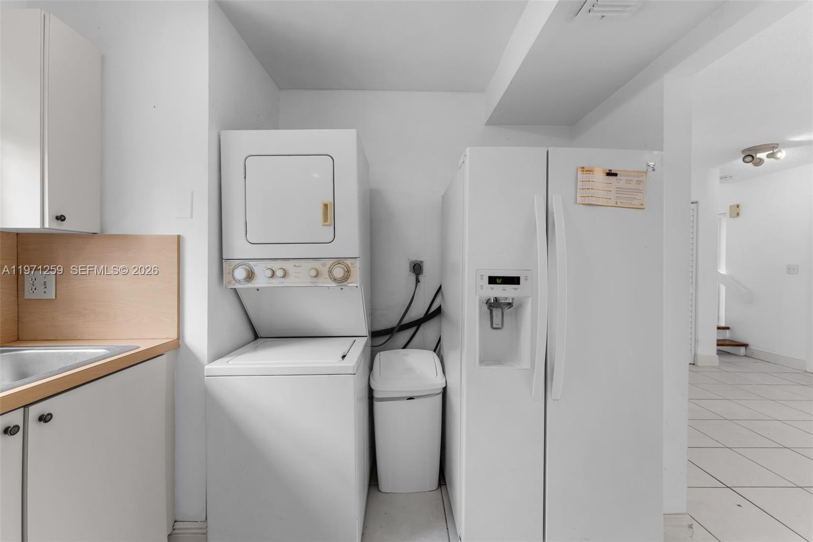 10915 Southwest 71st Street Miami, FL 33173 - Photo 12 of 33 a utility room with dryer and washer