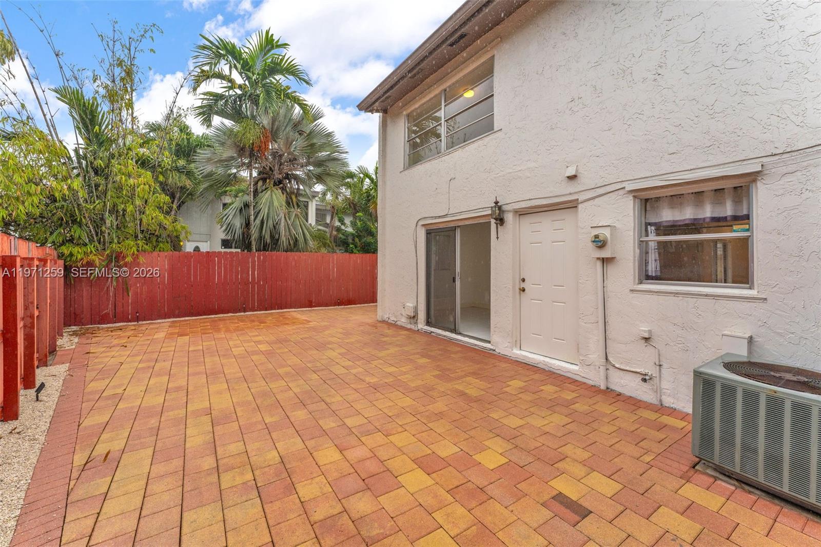 10915 Southwest 71st Street Miami, FL 33173 - Photo 24 of 33 a view of backyard with wooden fence