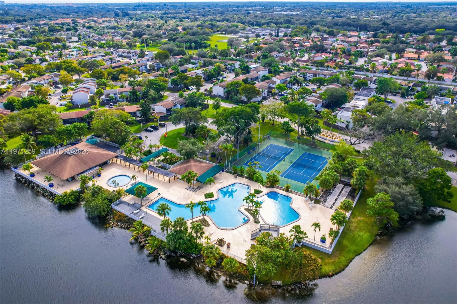 10915 Southwest 71st Street Miami, FL 33173 - Photo 31 of 33 an aerial view of a house with a yard and lake view