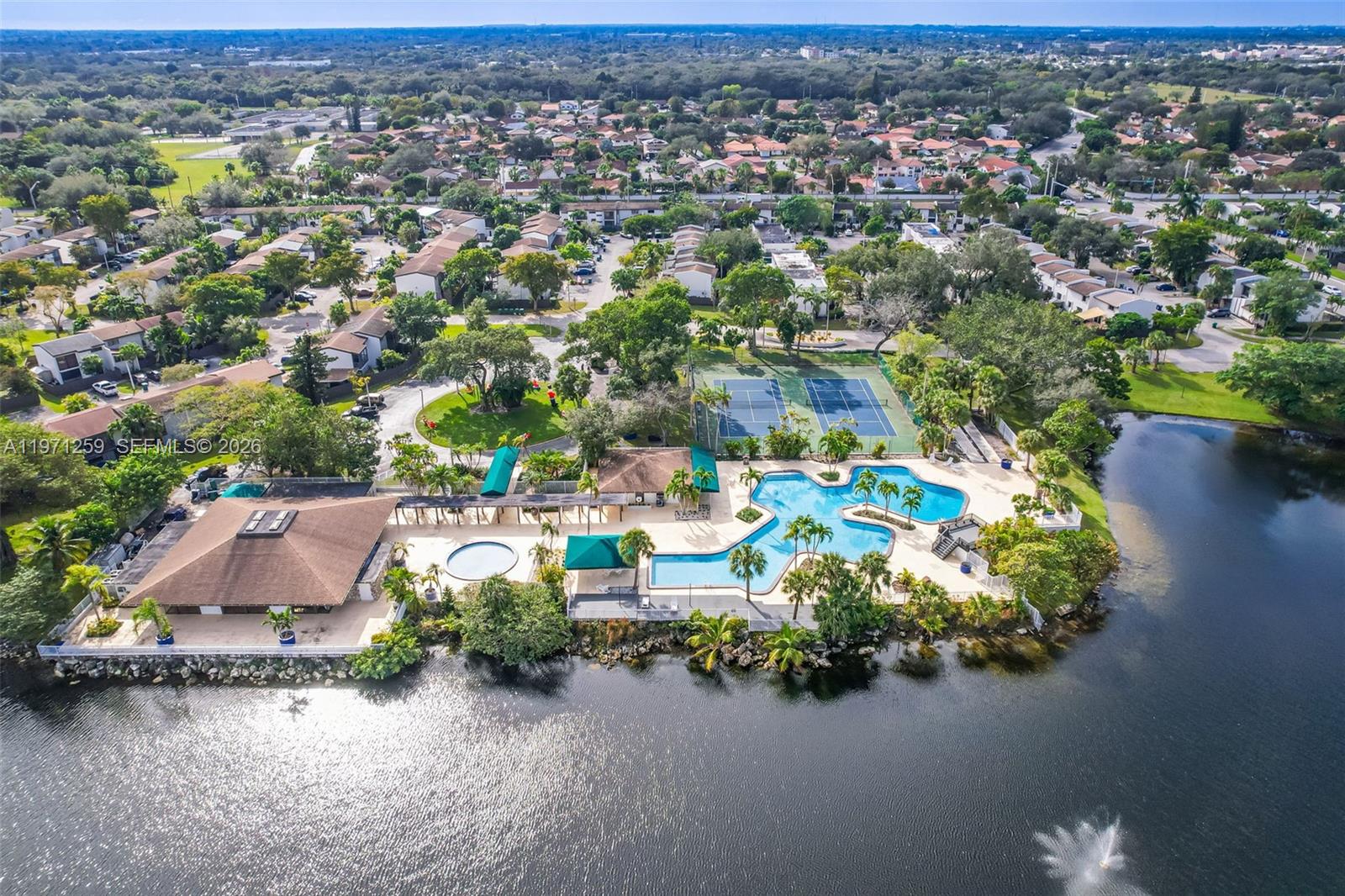 10915 Southwest 71st Street Miami, FL 33173 - Photo 32 of 33 an aerial view of a house with a garden and lake view
