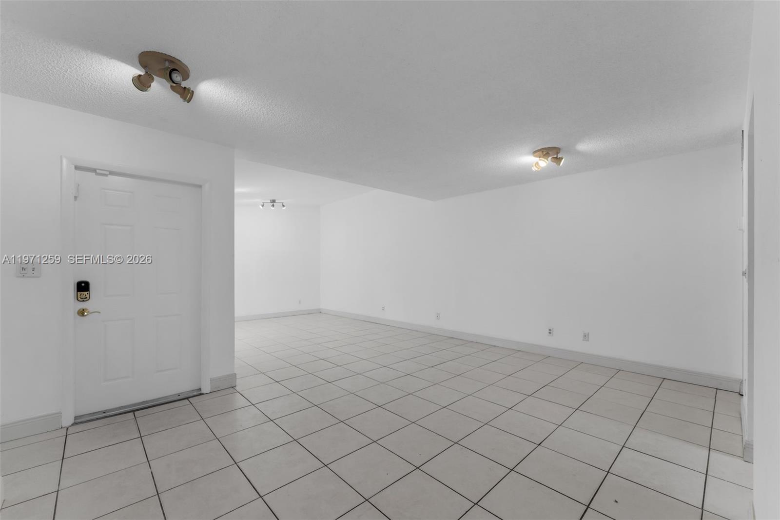 10915 Southwest 71st Street Miami, FL 33173 - Photo 9 of 33 a view of an empty room