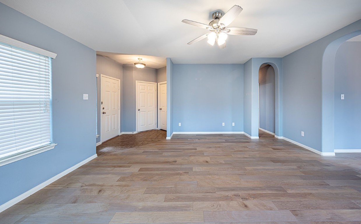 22715 Imperial Ivy Court Spring, TX 77373 - Photo 12 of 45 a view of a room with a ceiling fan and a window