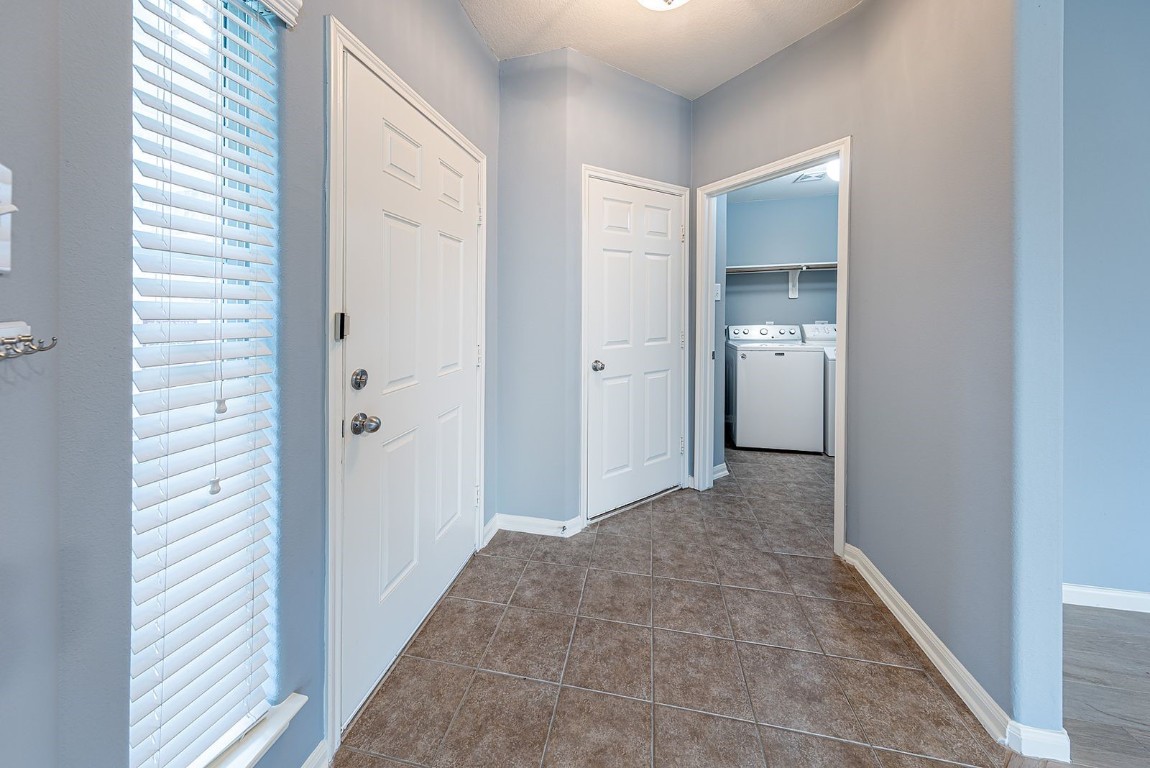 22715 Imperial Ivy Court Spring, TX 77373 - Photo 13 of 45 a view of a hallway with closet and wooden floor
