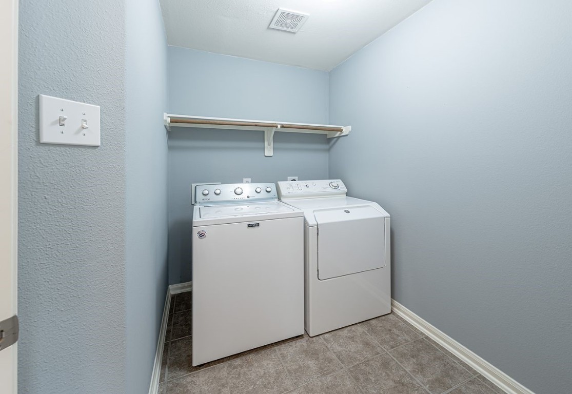 22715 Imperial Ivy Court Spring, TX 77373 - Photo 14 of 45 a utility room with dryer and washer