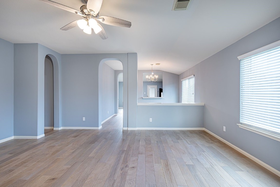 22715 Imperial Ivy Court Spring, TX 77373 - Photo 15 of 45 a view of empty room with wooden floor and fan