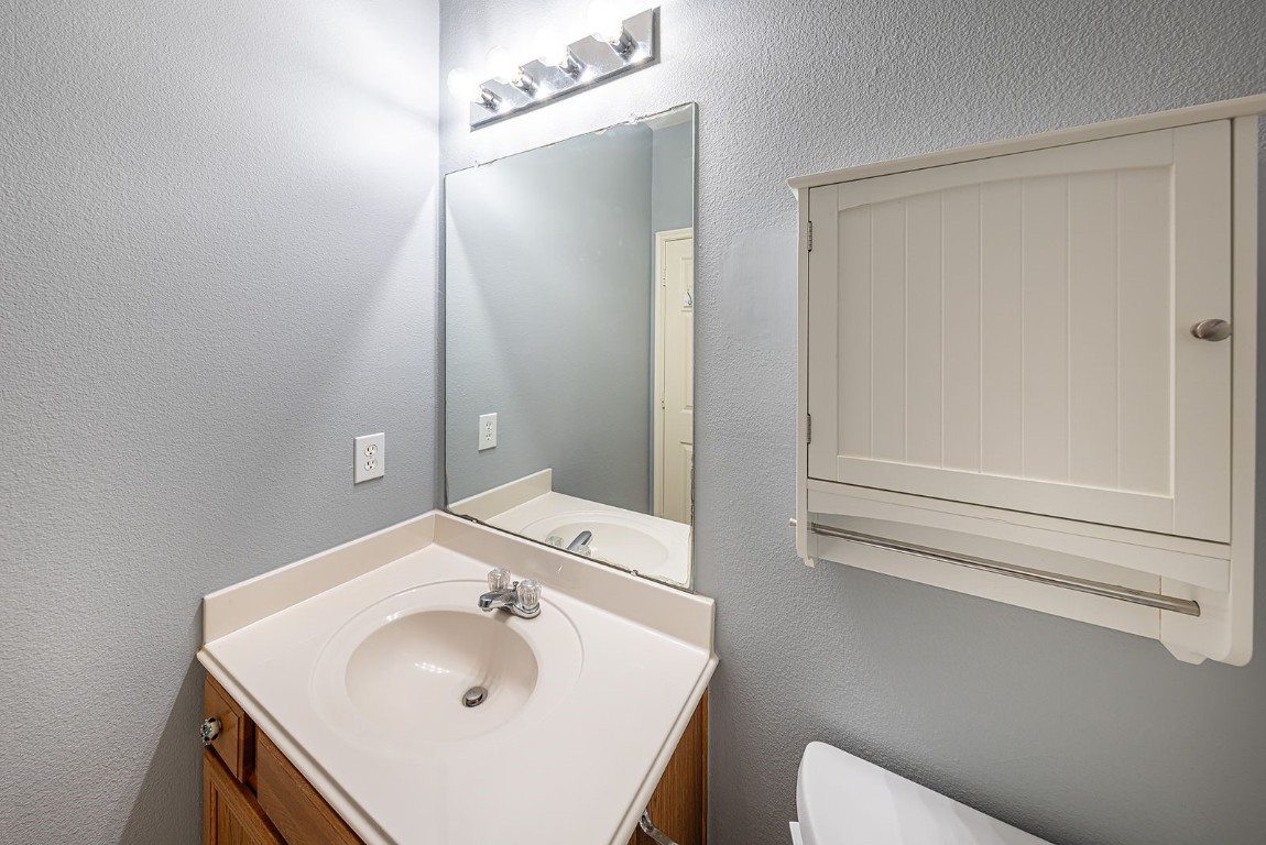 22715 Imperial Ivy Court Spring, TX 77373 - Photo 18 of 45 a bathroom with a sink and a mirror
