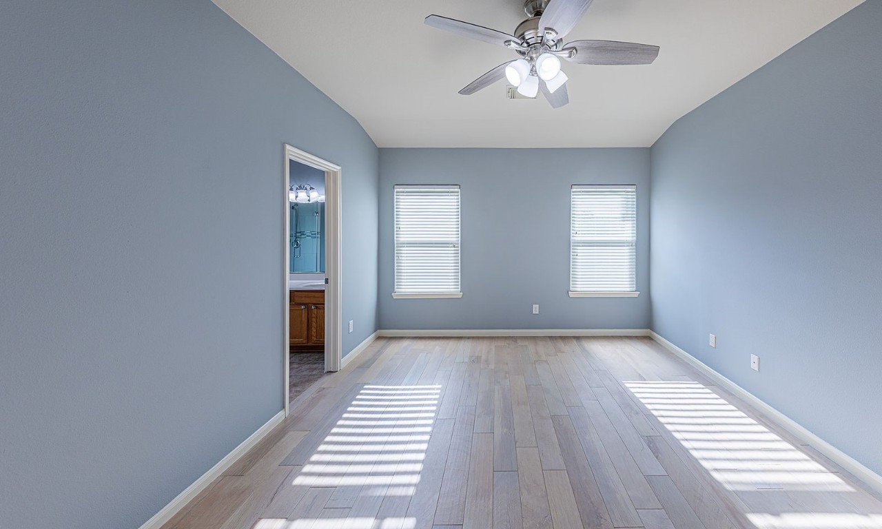 22715 Imperial Ivy Court Spring, TX 77373 - Photo 24 of 45 a view of empty room with wooden floor and fan