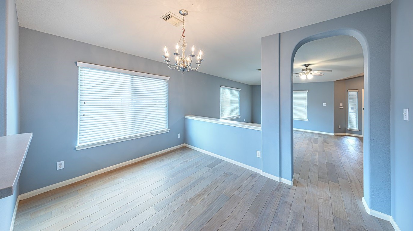 22715 Imperial Ivy Court Spring, TX 77373 - Photo 30 of 45 wooden floor in an empty room with a window