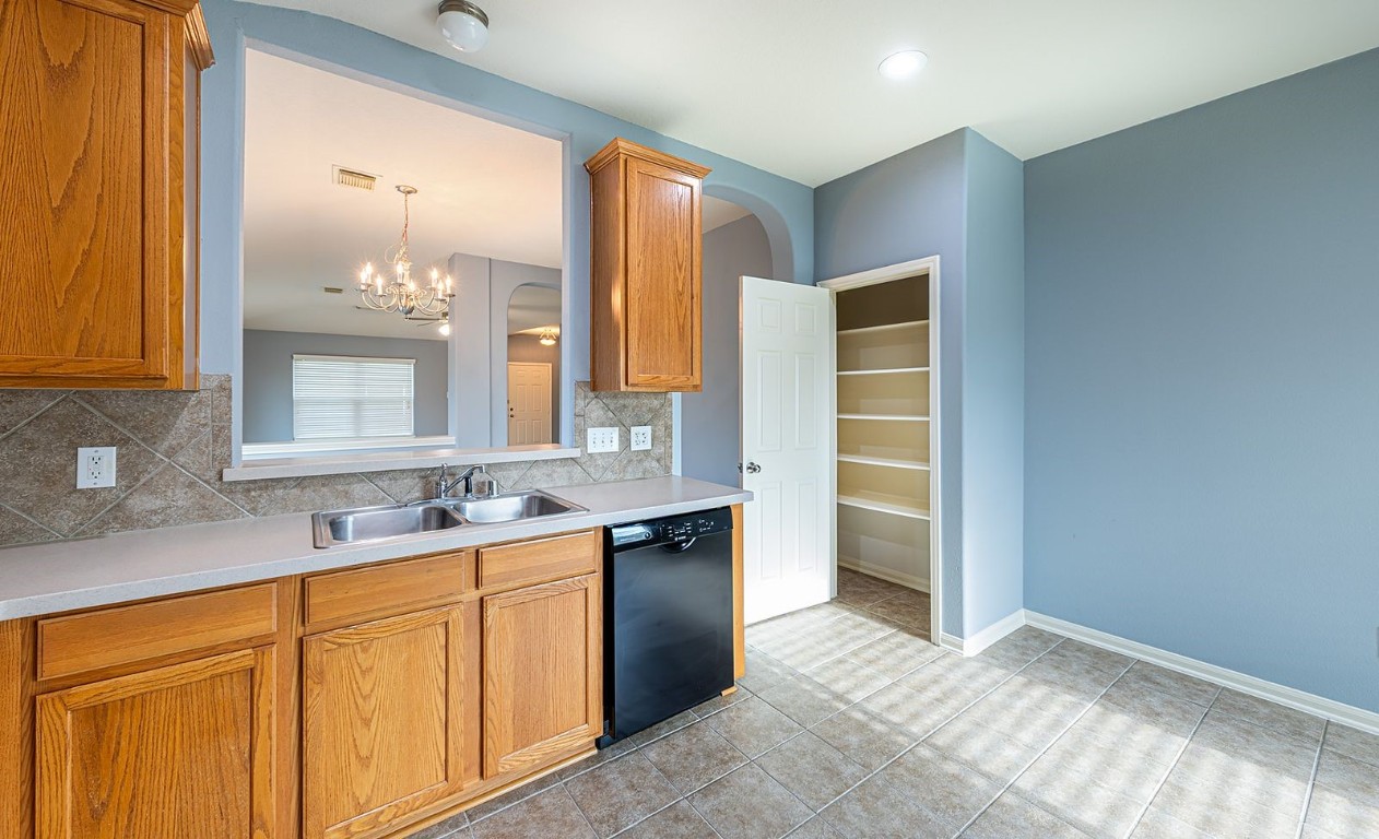 22715 Imperial Ivy Court Spring, TX 77373 - Photo 34 of 45 a bathroom with a granite countertop sink and a mirror