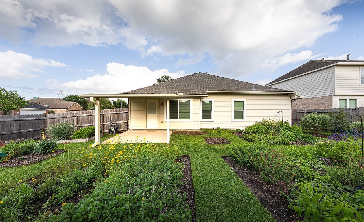 22715 Imperial Ivy Court Spring, TX 77373 - Photo 40 of 45 a house view with a garden space