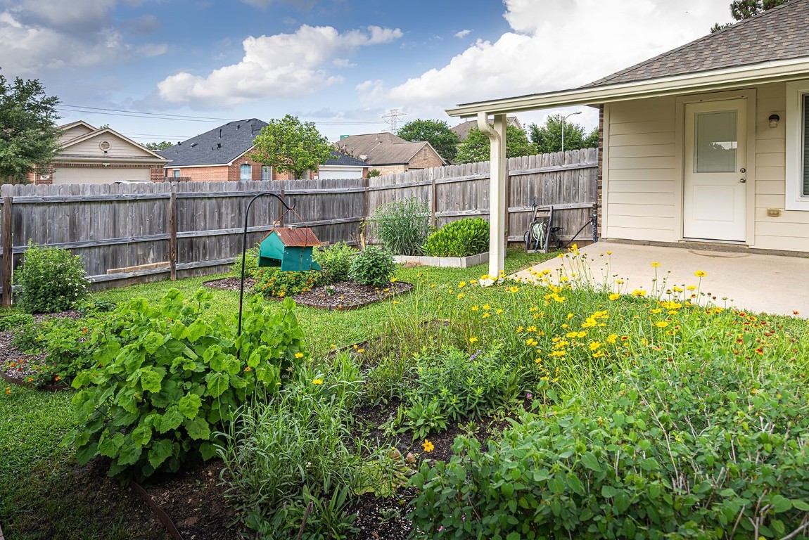 22715 Imperial Ivy Court Spring, TX 77373 - Photo 41 of 45 a view of a backyard with a garden